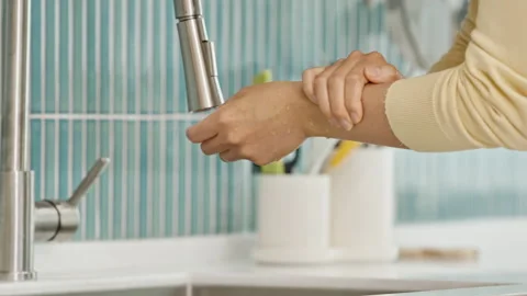 Closeup of Hands Holding Supplement Pills Over White Surface Stock Footage 339520183