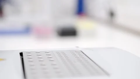 Closeup of hands introducing samples in machine 스톡 동영상 255196074