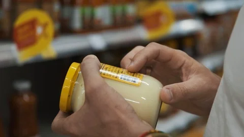 Closeup hands male customer reading label of shopping at supermarket Stock Footage 123204604