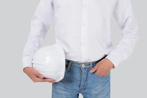 Closeup hands of man is engineer holding helmet standing and with confident.. Foto stock