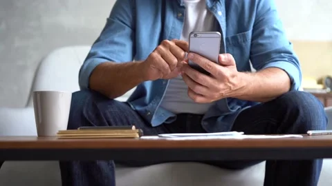 Closeup hands of mature man using smartphone, typing message on mobile phone. Stock Footage 141184320
