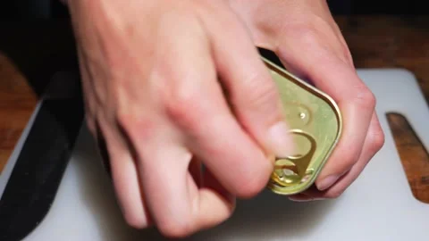 Closeup hands opening canned ham Stock Footage 141542429