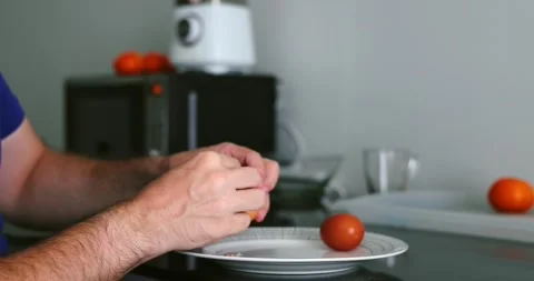 Closeup of hands peeling boiled egg in kitchen, food preparation Stock Footage 305935031
