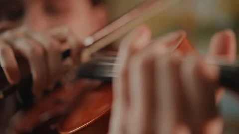 Closeup of hands playing instrument with focus. Intimate view of young musician Stock Footage 346561702