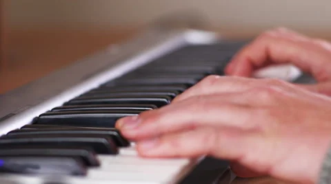Closeup of hands playing keyboard with focus shifts Stock Footage 50205712