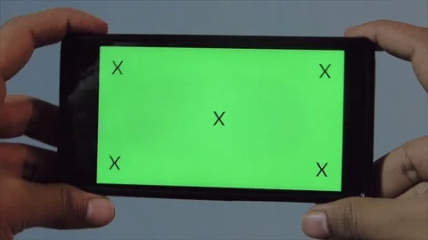 Closeup Hands playing on mobile with Green Screen + marks Stock Footage 74257803