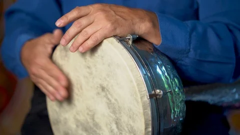 Closeup of hands playing slow drumming rhythm on metal Turkish daholla Stock Footage 94241912