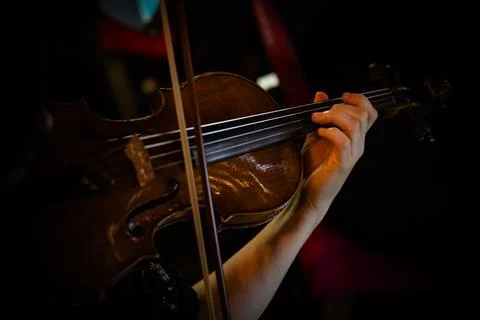 Closeup of hands playing violin Stock Photos