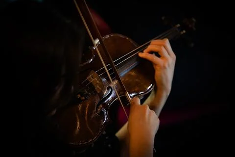 Closeup of hands playing violin Stock Photos