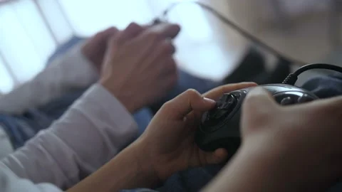 Closeup hands pressing control buttons of joystick Video stock 104011596