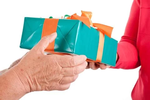 Closeup, hands reaching each other a gift Foto stock