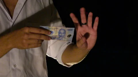 Closeup Hands Roll up Banknote for Trick against Darkness Stock Footage