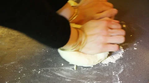 Closeup of hands rolling dough on table with flour Stock Footage 40732296