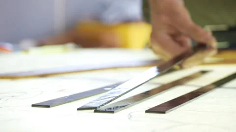 Closeup of hands scoring and snapping stained glass Stock Footage 33063704