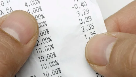 Closeup hands scrolling and checking receipt or bill discovering expensive to Stock Footage 127188883