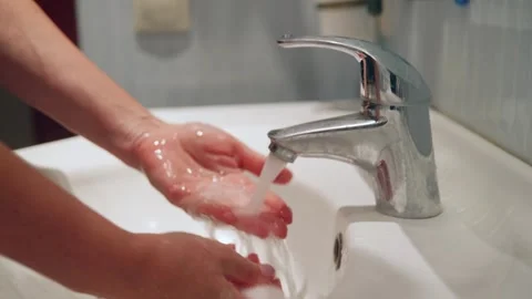 Closeup of hands scrubbing with soap and foam during morning hygiene routine Stock Footage 331372638