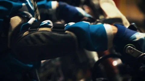 Closeup on the hands, shoulder pads and helmet of an endurocross racer as Stock Footage 91310311
