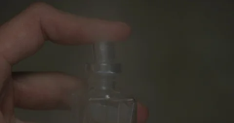 Closeup of hands spraying perfume Stock Footage 105501737