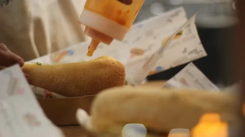 Closeup of hands stuffing sandwiches Stock Footage 64434693