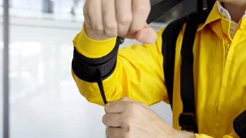 Closeup of hands taking off exoskeleton Stock Footage 256781856