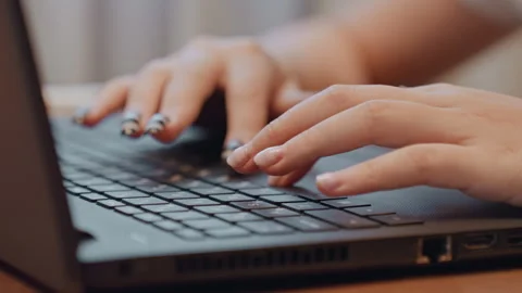 Closeup hands typing on laptop keys manicured nails zebra art beauty blogger Stock Footage 335893221