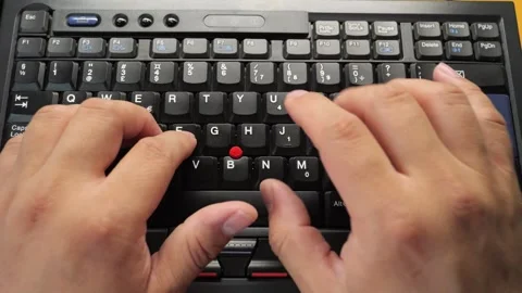 Closeup of hands typingworking on a laptop computer keyboard with black keys 库存影片 279286473