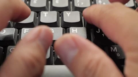 Closeup of hands typingworking on a laptop computer keyboard with black keys Stock Footage 279286501
