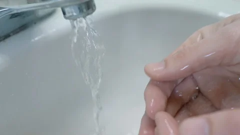 Closeup of Hands under Running Water Stock Footage 126554401