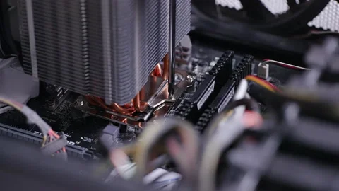 Closeup hands of unrecognizable technician using screwdriver to fix PC CPU air Stock Footage 234004089