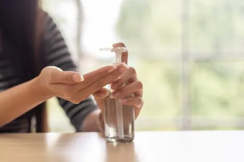 Closeup  hands using alcohol gel for sanitizer anti virus bacteria. Stock Photos