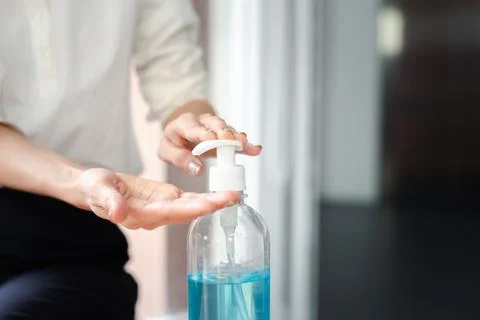 Closeup  hands using alcohol gel for sanitizer anti virus bacteria. Stock Photos