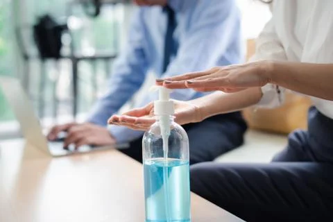 Closeup  hands using alcohol gel for sanitizer anti virus bacteria. Stock Photos