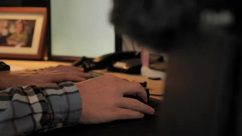 Closeup of Hands Using Computer Mouse and Tapping Keys Video stock 170696884