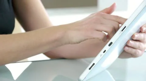 Closeup on hands using electronic tablet Stock Footage 14824621