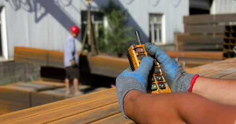 Closeup of hands using remote control of gantry crane Stock Footage 205563002