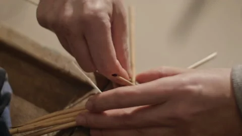 Closeup of hands weaving a basket from willow branches Stock Footage 170202498