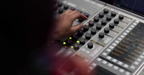 Closeup hands working a control mixer in a recording studio Stock Footage 82674950