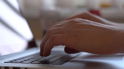 Closeup of hands working / typing on a laptop keyboard with black keys Stock Footage 100021164