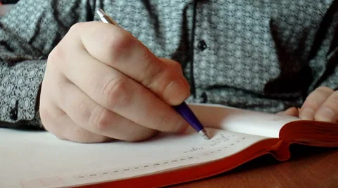Closeup hands writing in diary Stock Footage 43037662