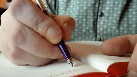 Closeup hands writing in diarycinema 01 Stock Footage 43196227