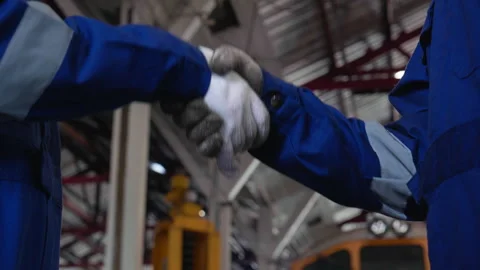 Closeup hands of young caucasian engineer man and woman doing agreement whi.. Stock Footage 252027957