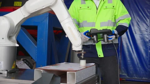 Closeup hands young engineer man checking and maintenance machine robot arm.. Stock Footage 236855101