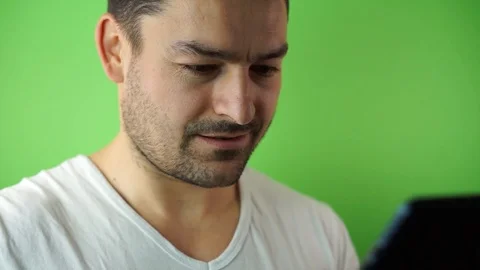 Closeup of hands of young man in checkered shirt using mobile phone while his Stock-Footage 87175815