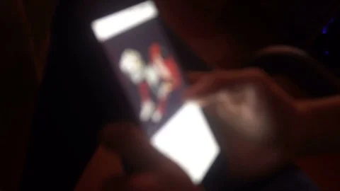 Closeup of hands of a young man flipping through the news on the smartphone Video stock 83622727