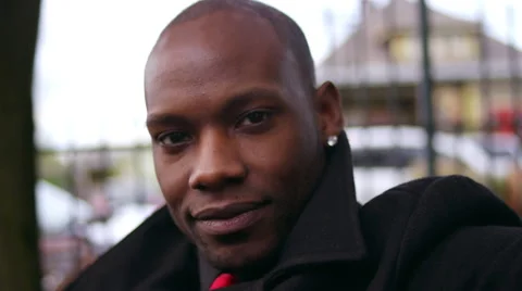 Closeup of a handsome man smiling at the camera, slow motion Видео 56887936