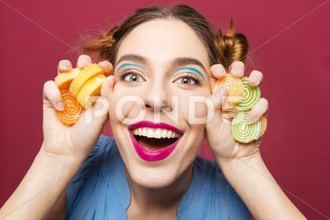 Closeup Of Happy Funny Young Woman With Marmalade Candies