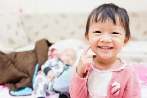 Closeup of happy little child playing over the bed in a relaxed morning with  Stock-Fotos