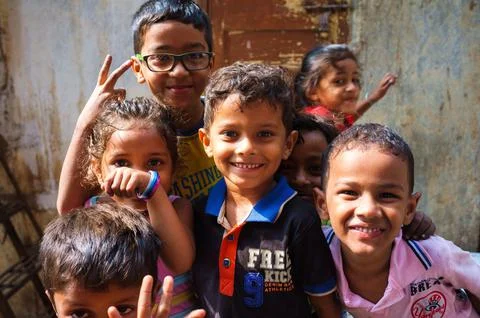Closeup of happy smiling poor children from Banganga slum in Mumbai, India Stock Photos