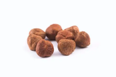 Closeup of hazelnuts, isolated on the white background, clipping path include Stock Photos