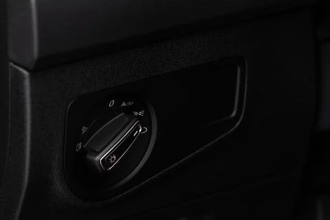 Closeup of the headlight switch control button. Lights control panel in car Stock Photos